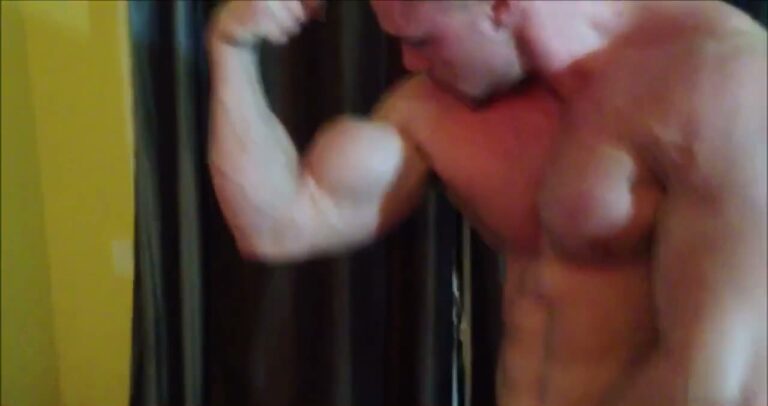 Muscle King Flexes And Sticks Out His Tongue