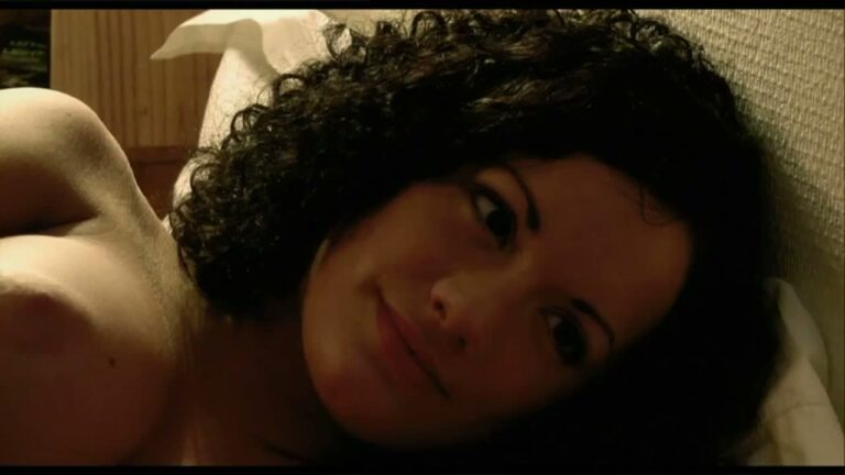 Fondles Self While In Bed With Woman